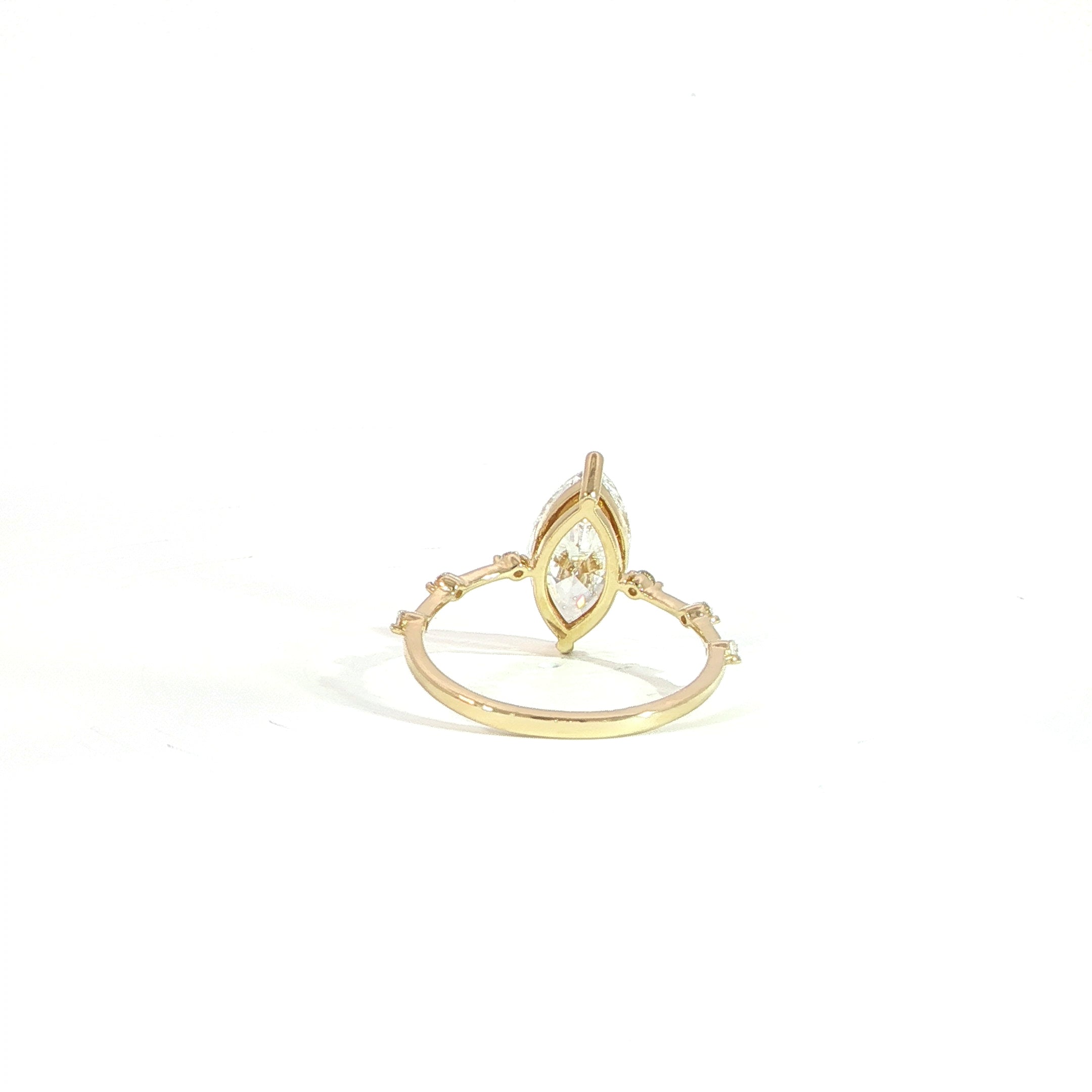 IGI certified marquise diamond engagement ring with delicate station band