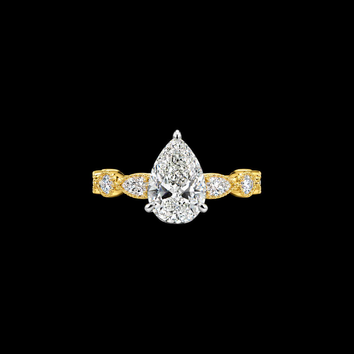 Pear diamond engagement ring with bezel set marquise and round diamond accents in yellow gold.