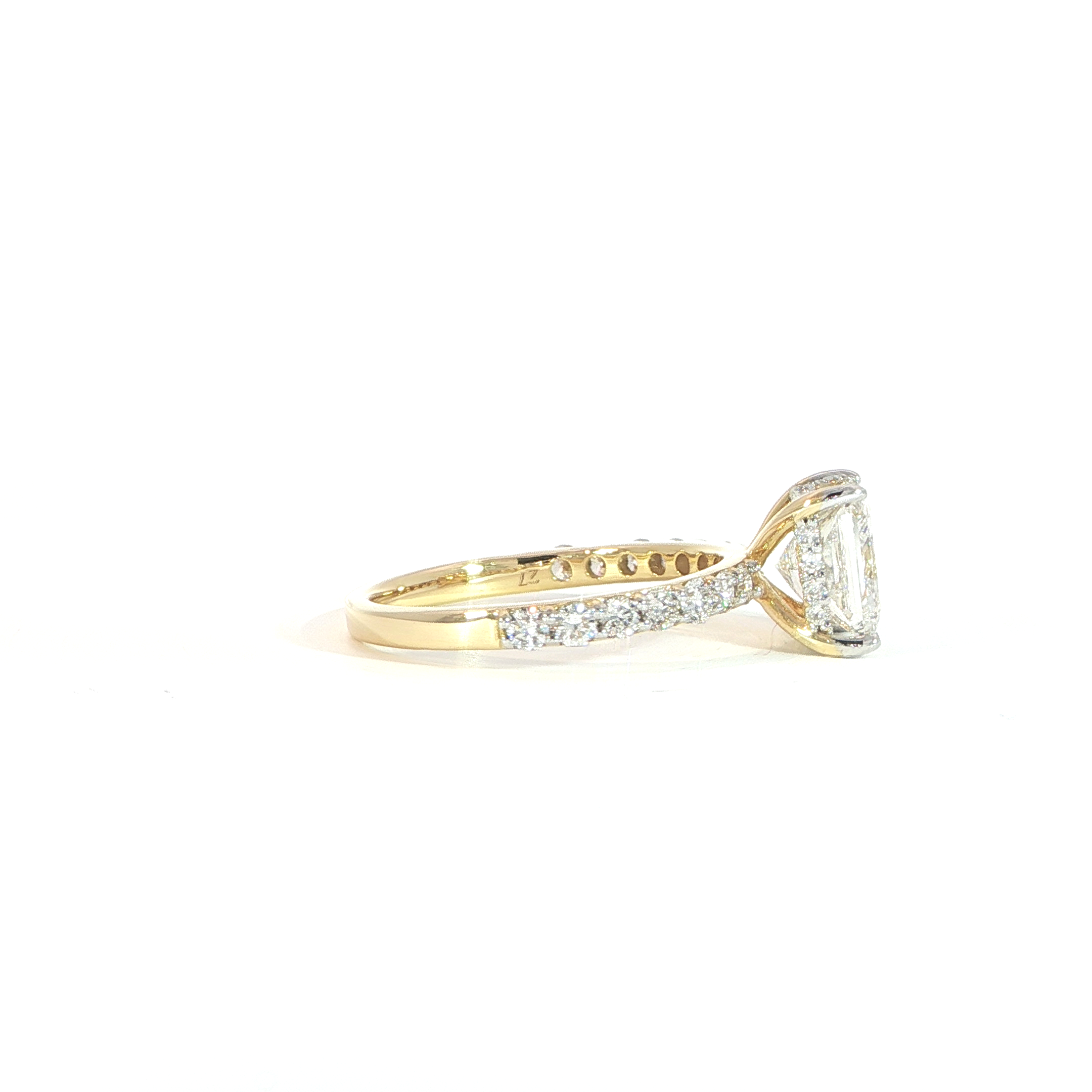 Side view of princess cut ring showing hidden halo detail