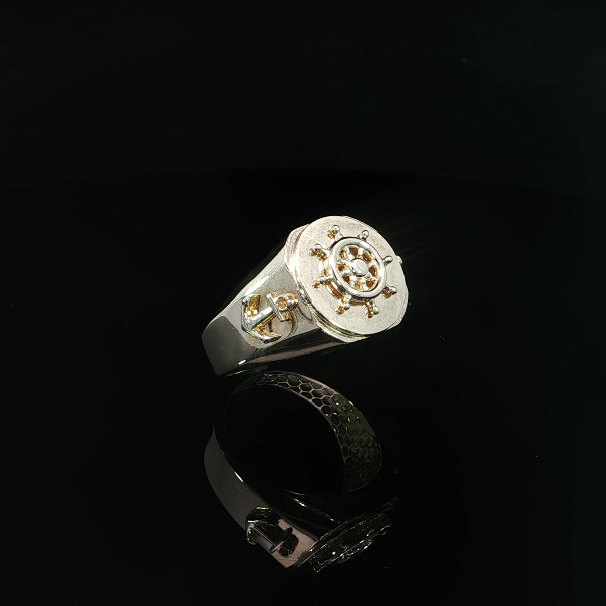 Mariner wheel signet ring in 14K yellow gold with a 15mm top and polished tapered shoulders.