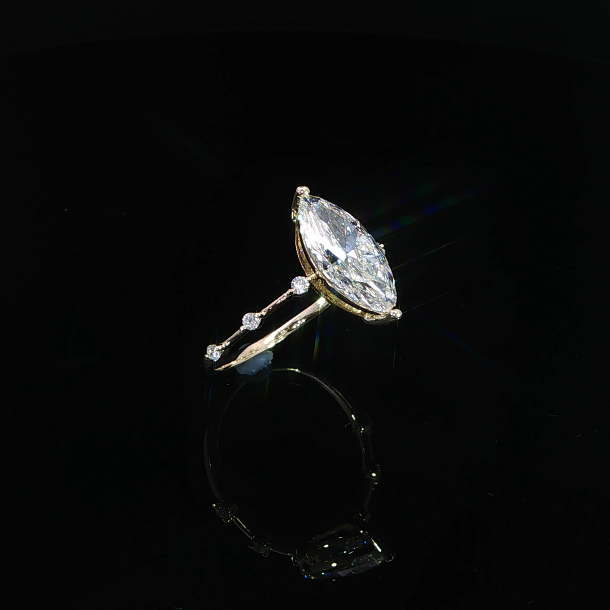 2.05-carat marquise lab-grown diamond engagement ring crafted in 14K yellow gold.