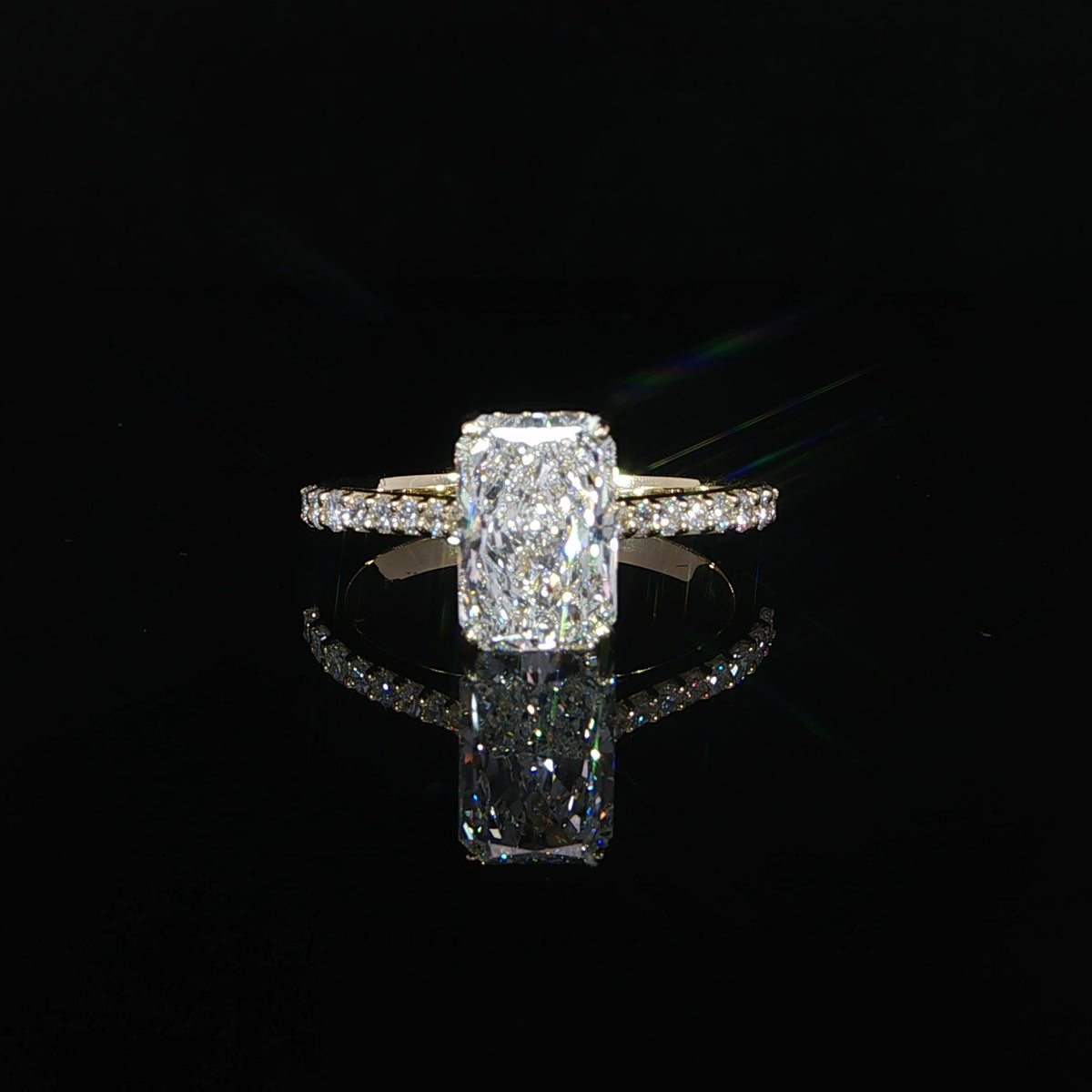 Front view of a 2.08 carat radiant lab-grown diamond ring in 14K yellow gold