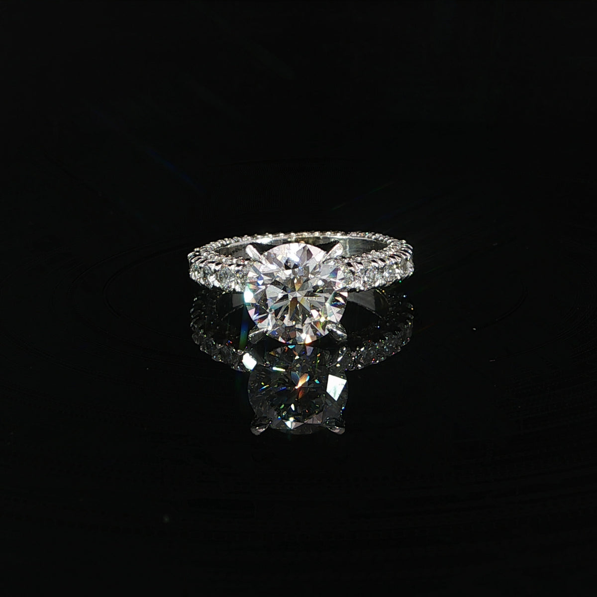 Front view of a 2.70 carat round diamond engagement ring in 18K white gold