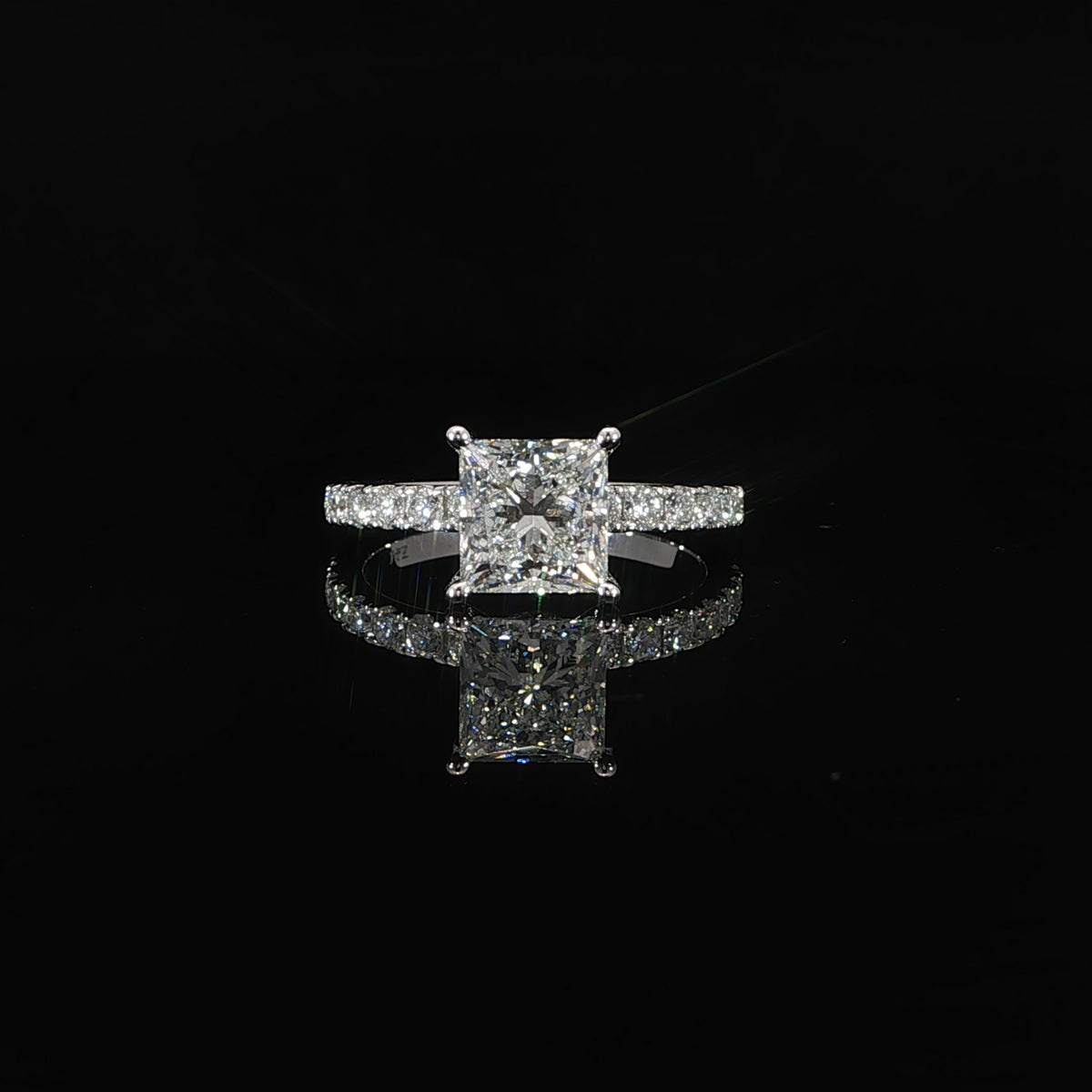 Front view of 2 carat princess cut lab grown diamond engagement ring in 14K white gold with pave diamond band.