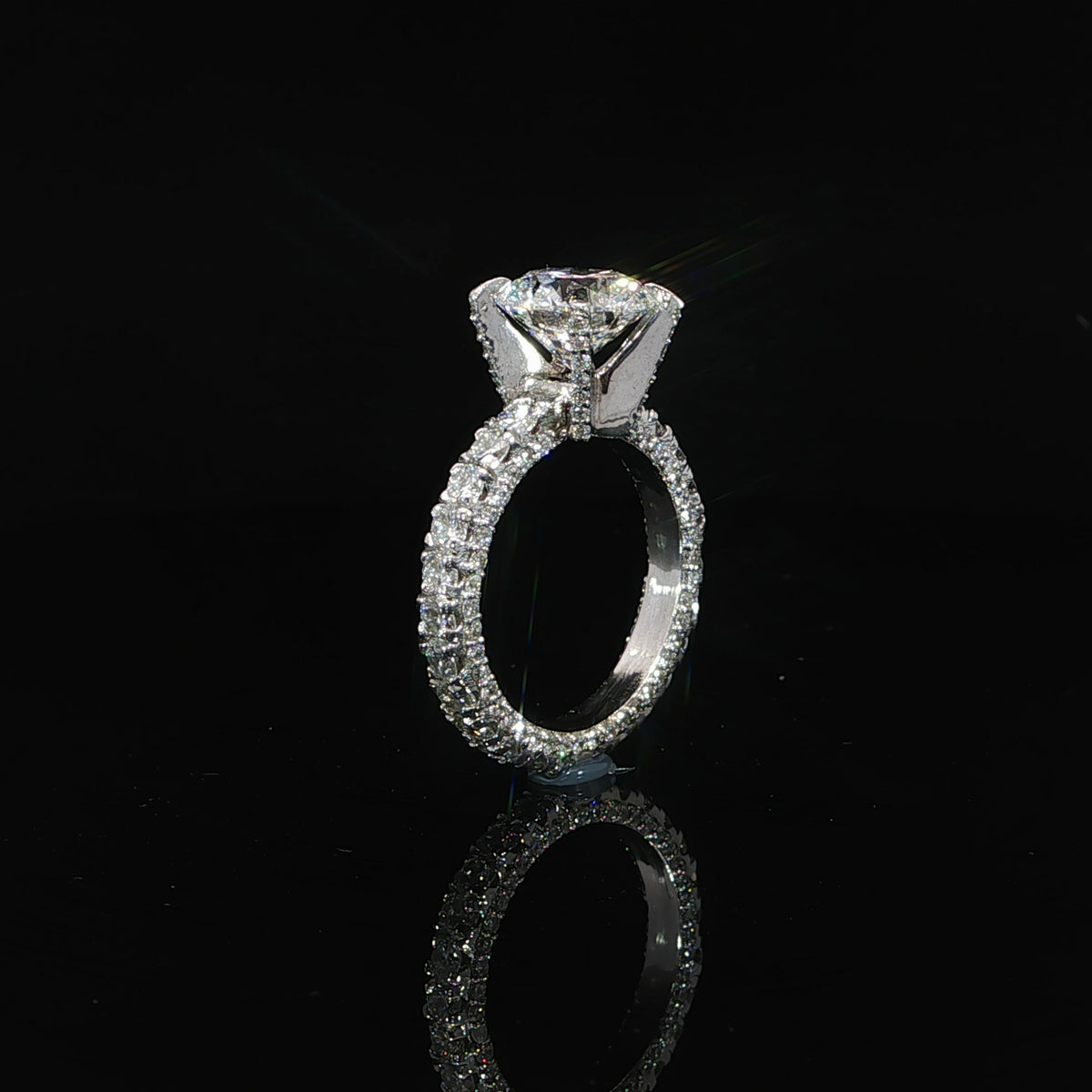 Round diamond engagement ring with a diamond eternity band and 4.75 carats total diamond weight