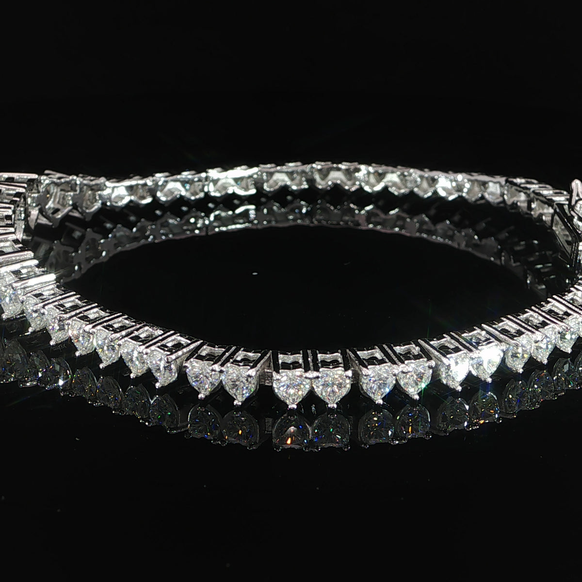Graduated heart moissanite tennis bracelet featuring 7.29 CTW
