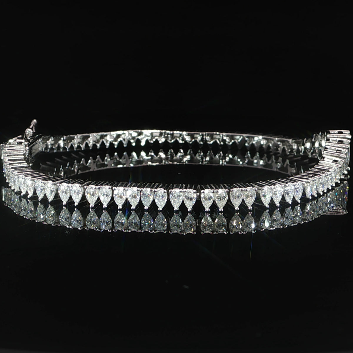 Pear-shaped moissanite bracelet graduating from an 8 mm center to 4 mm stones.