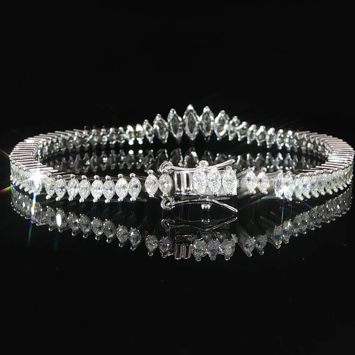 Clasp view of a sterling silver graduated marquise moissanite bracelet
