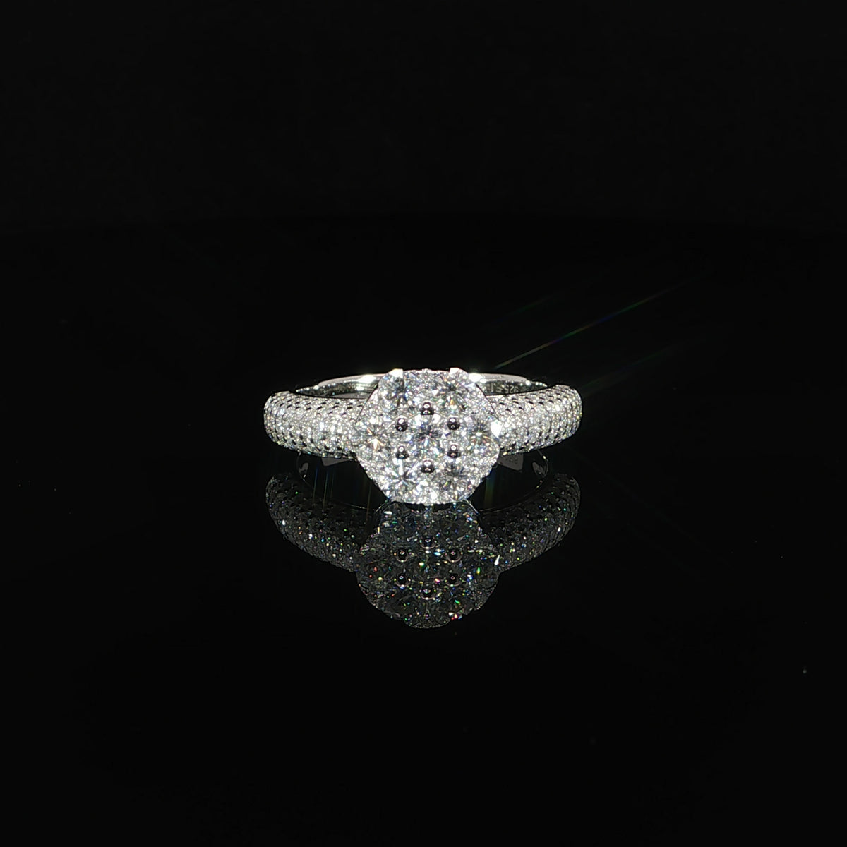 Front view of a 925 sterling silver ring featuring a sparkling multi-row moissanite cluster.