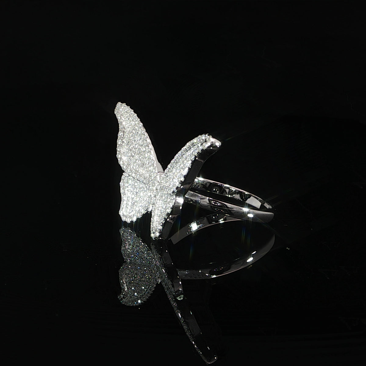 Large butterfly statement ring in polished 925 sterling silver with pavé-set moissanite.