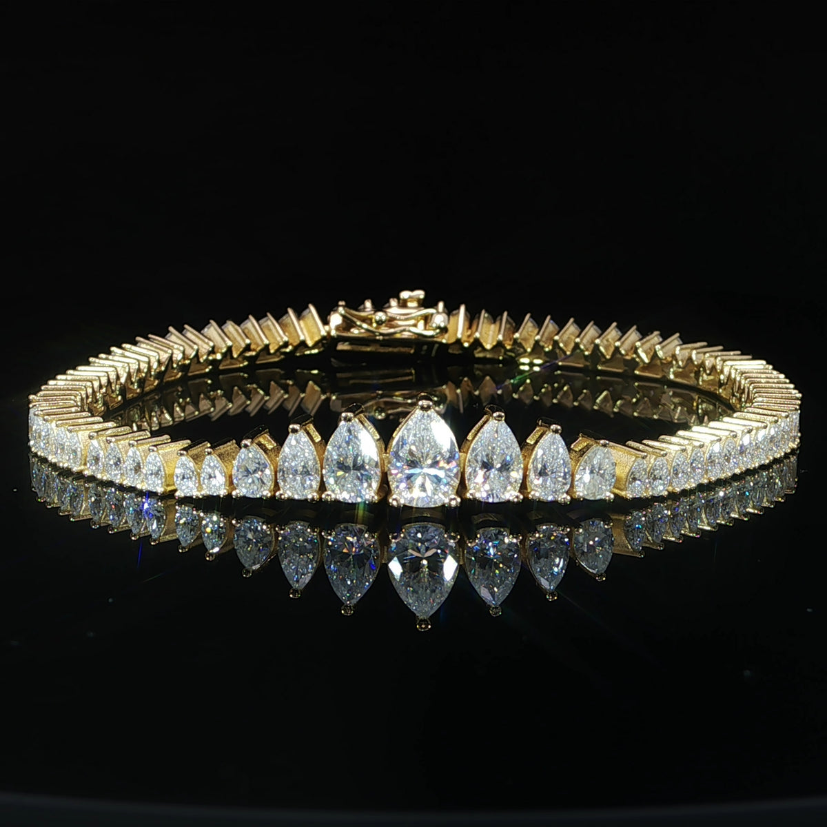 Front view of a sterling silver pear-cut moissanite tennis bracelet