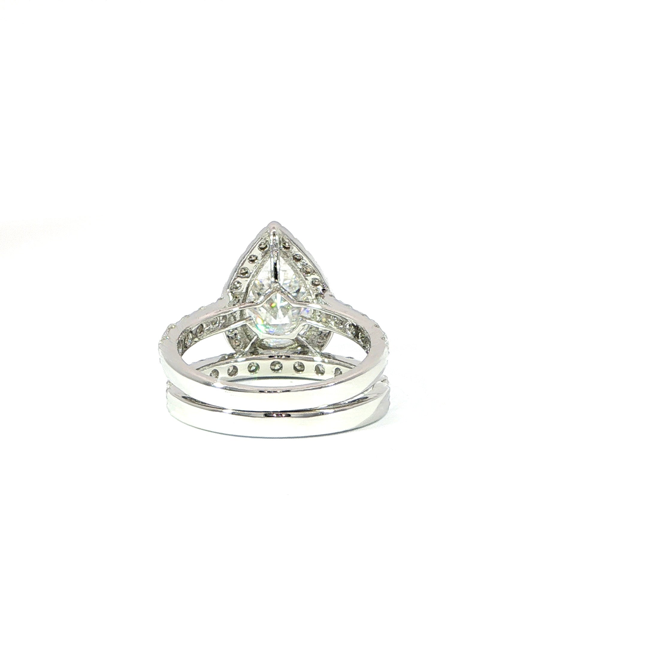 Elegant sterling silver pear halo engagement ring with matching band