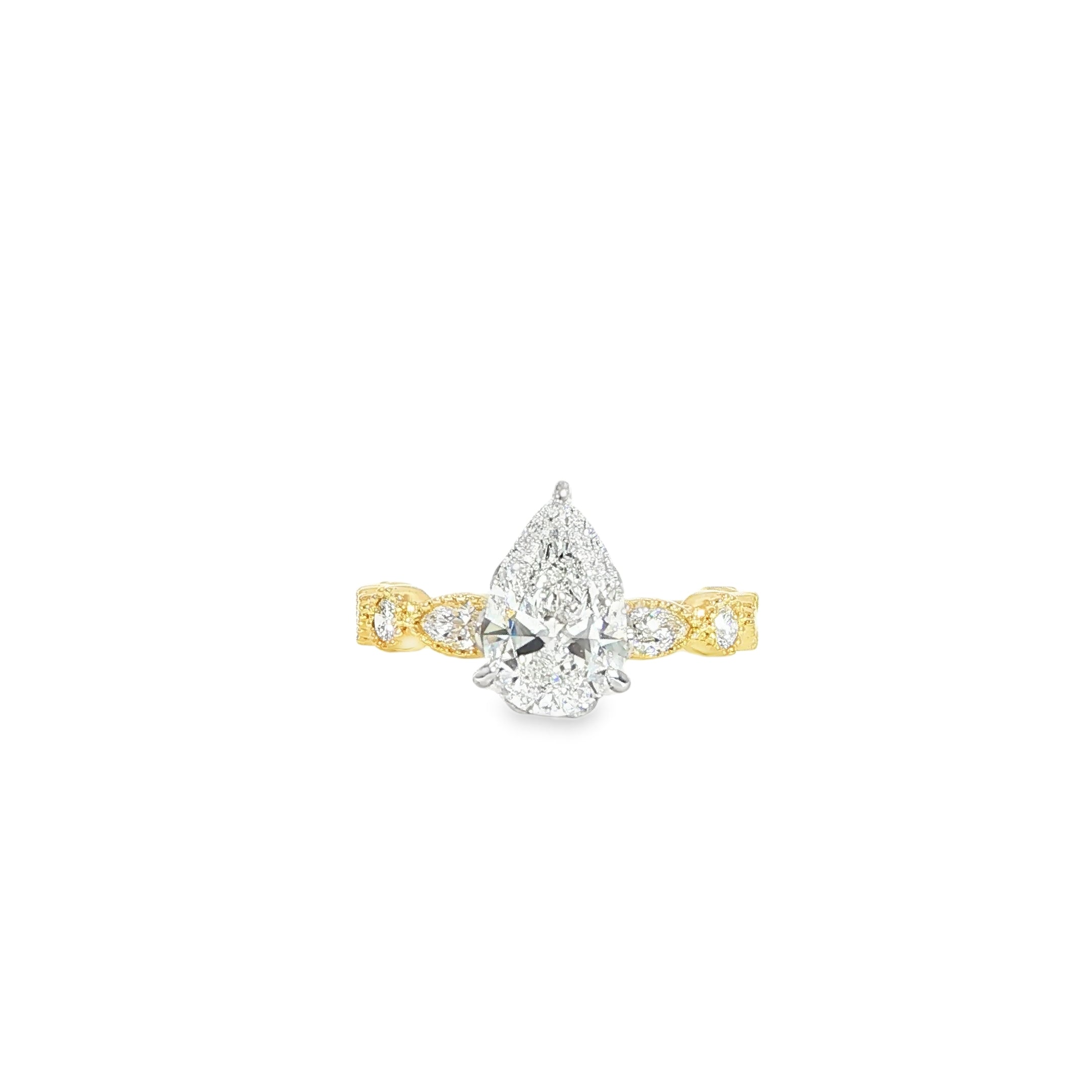 Yellow gold pear engagement ring with antique style design