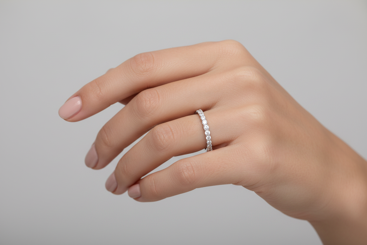 Classic bridal diamond band in white gold on hand model