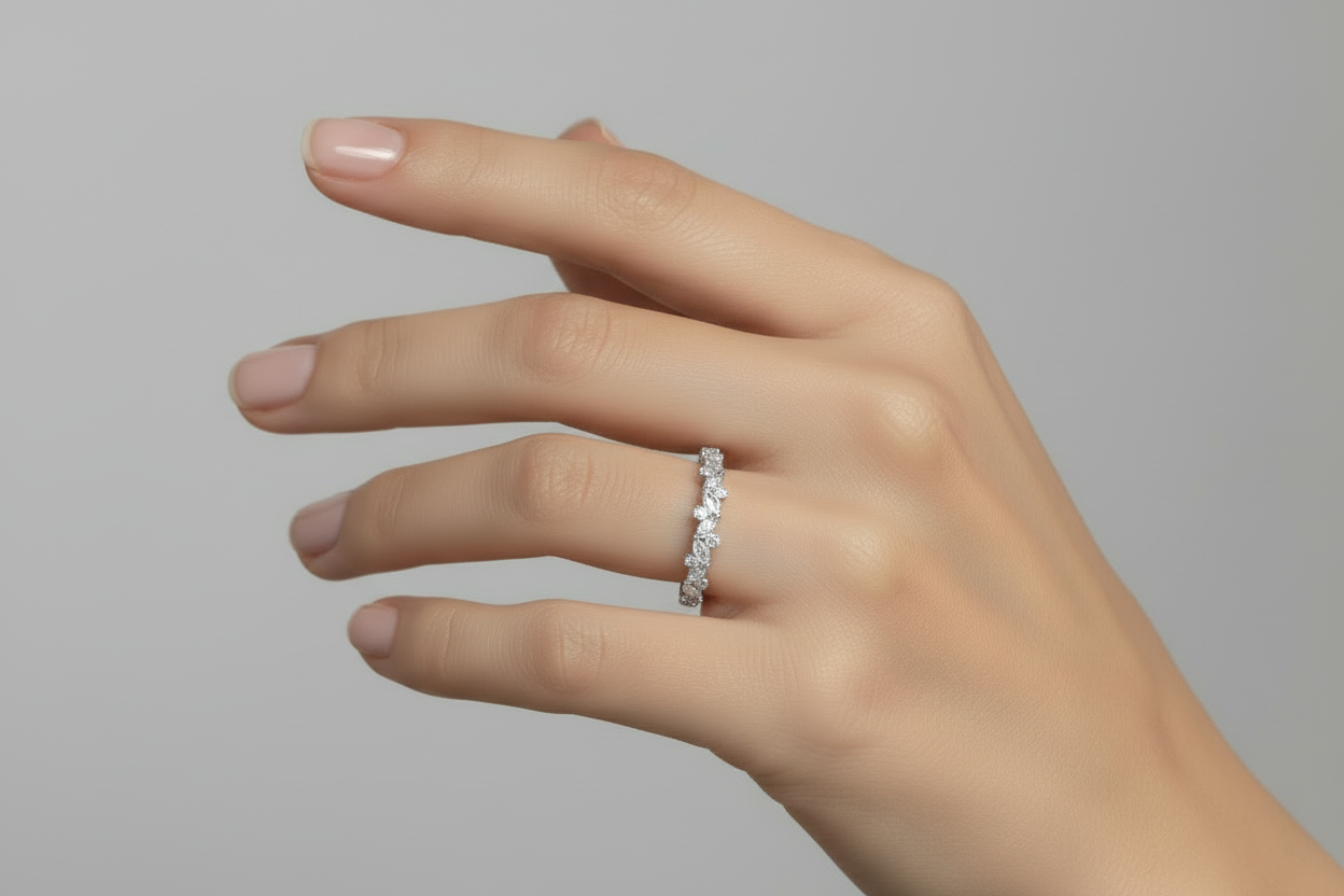 Hand model close-up of multi-shape diamond band with alternating stones