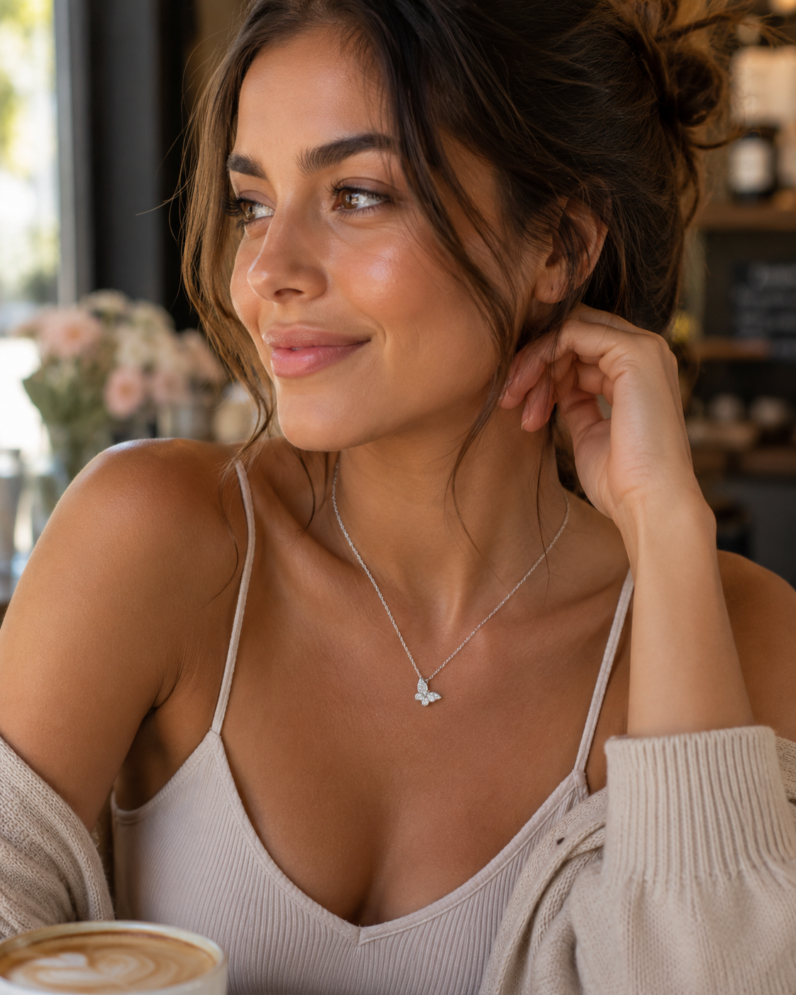 Women's sterling silver butterfly necklace with delicate sparkle.