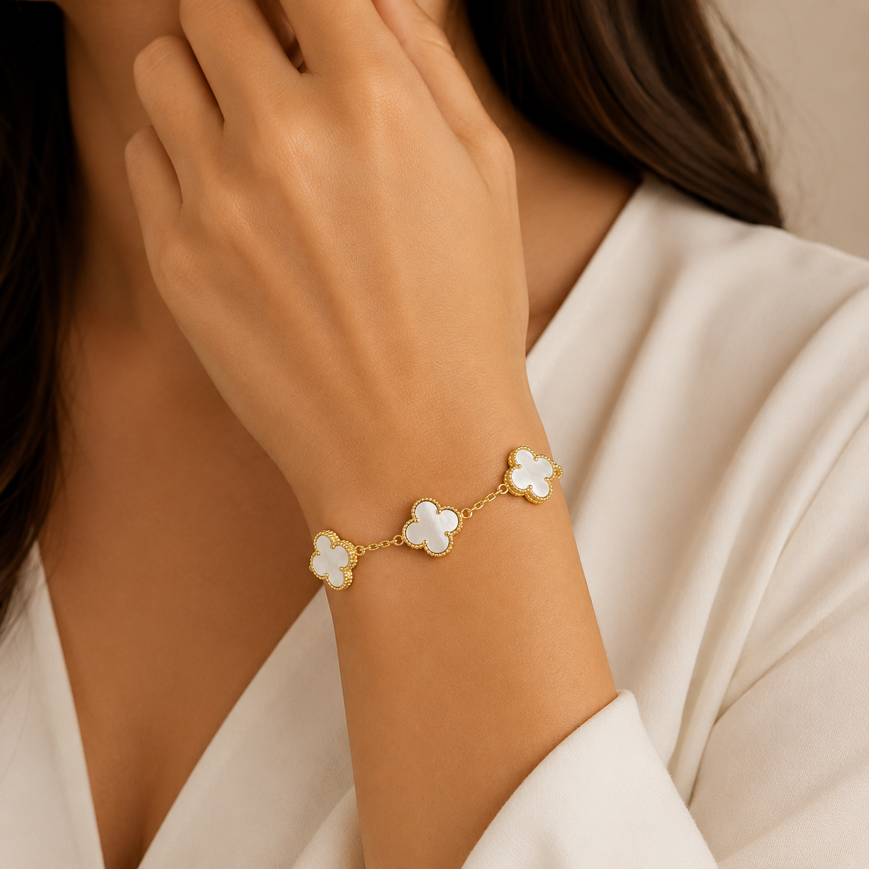 14K yellow gold bracelet featuring mother of pearl clover stations