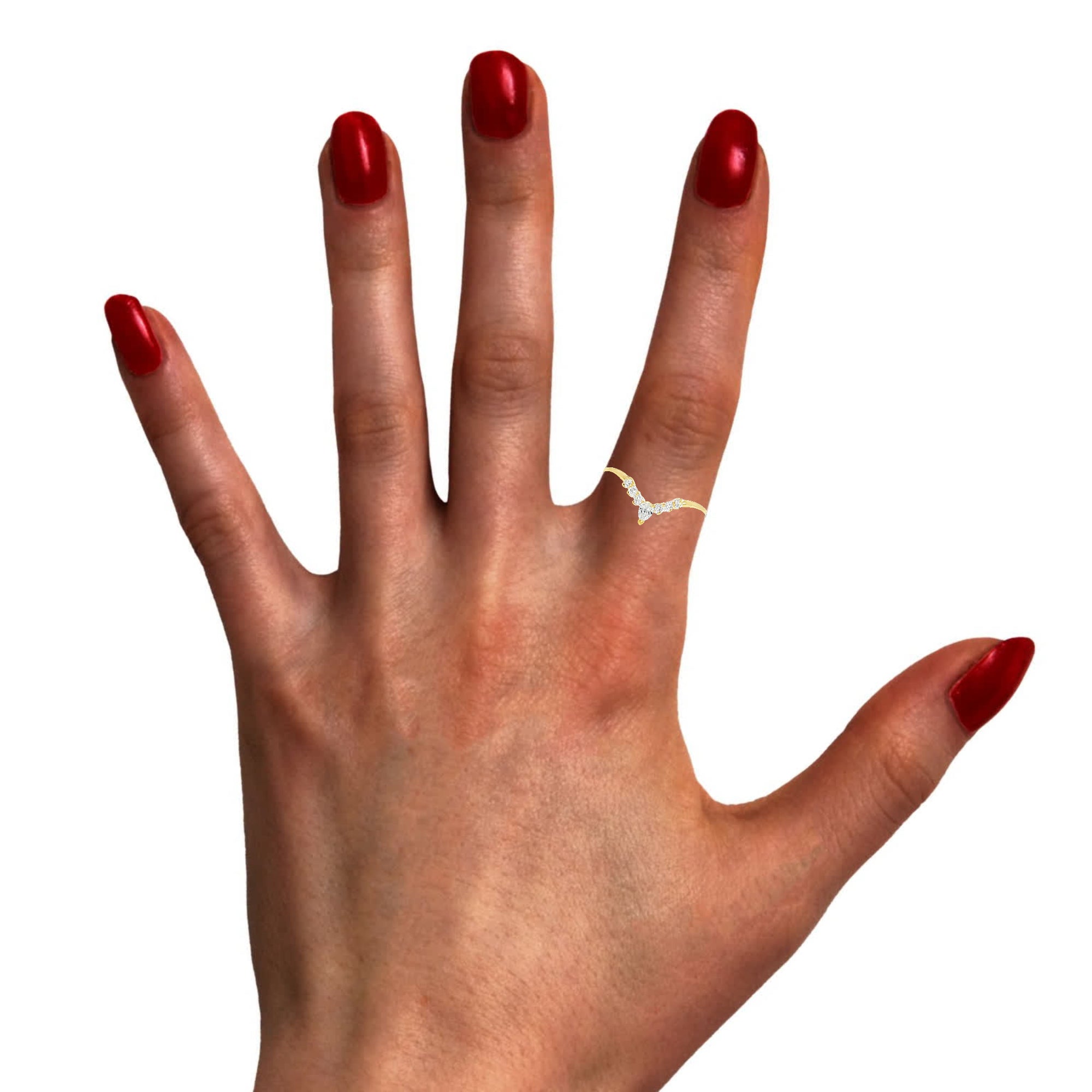 Model wearing delicate V-shaped diamond band in yellow gold