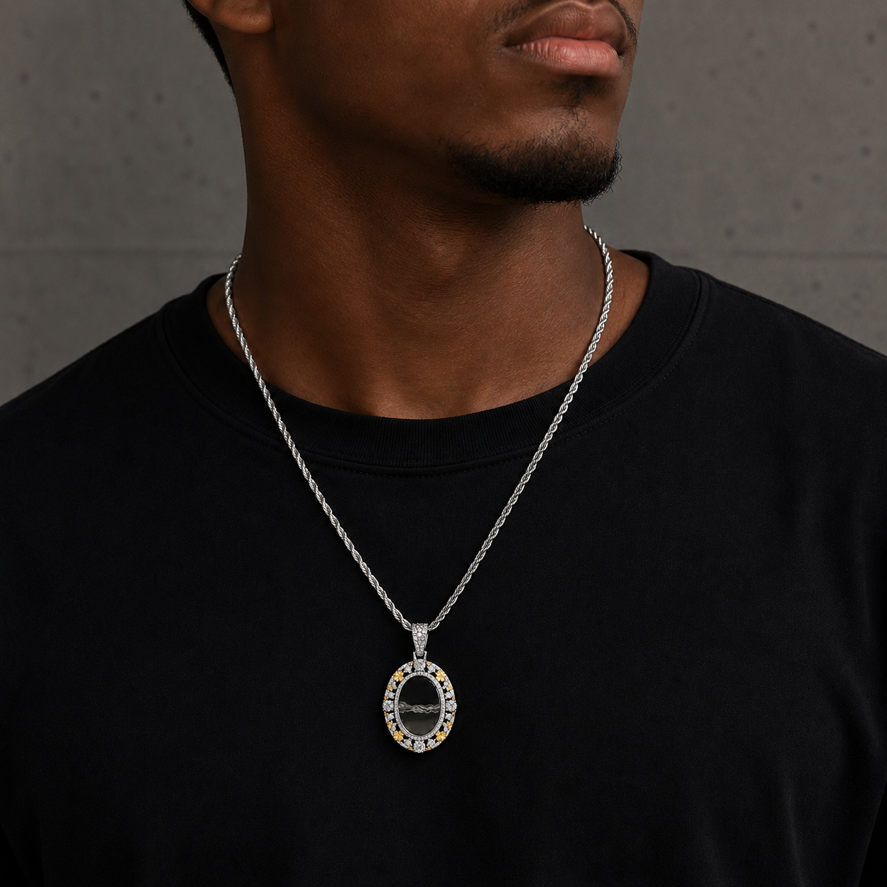 Model wearing silver oval picture frame with floral accents