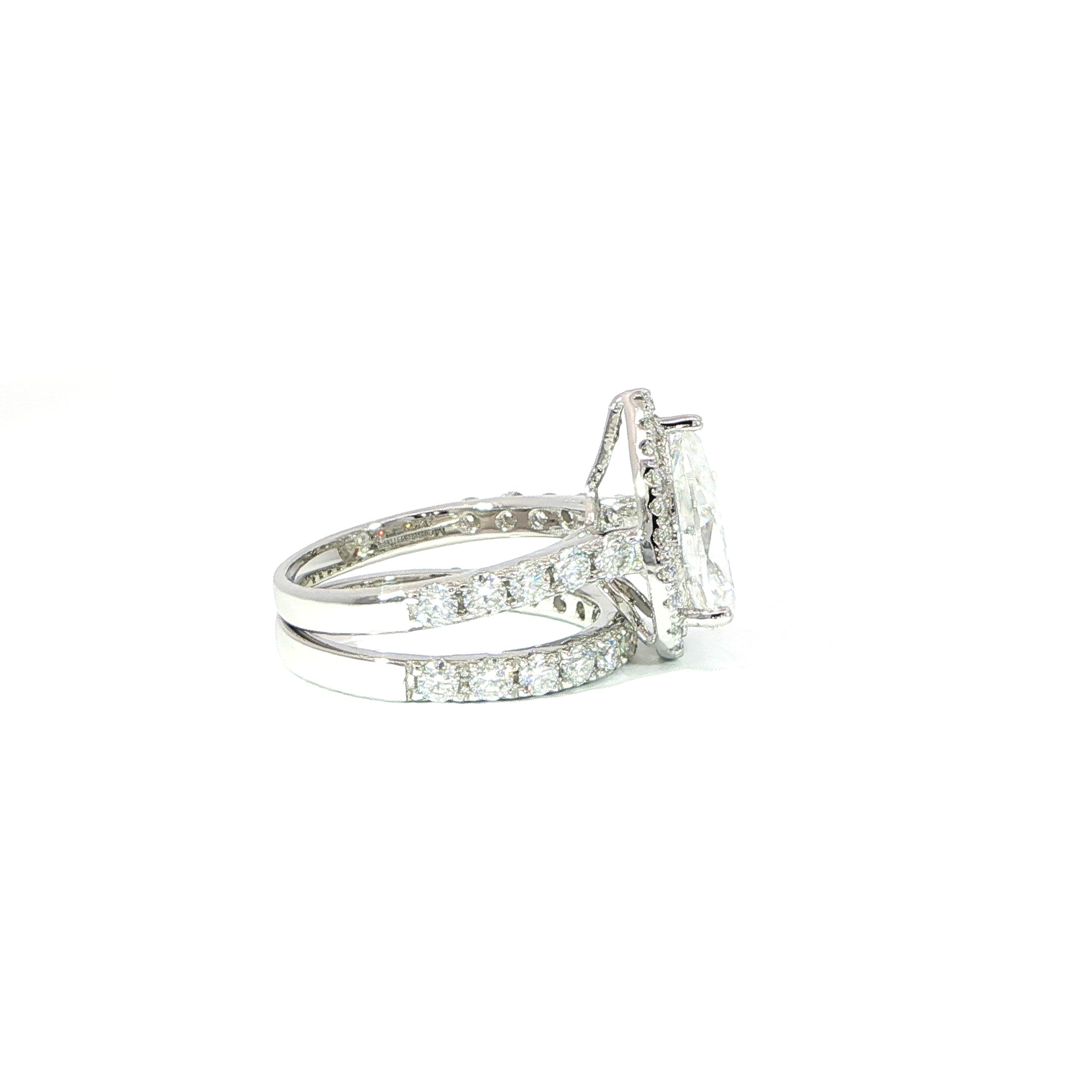 Pear-shaped moissanite bridal set with halo and pave band