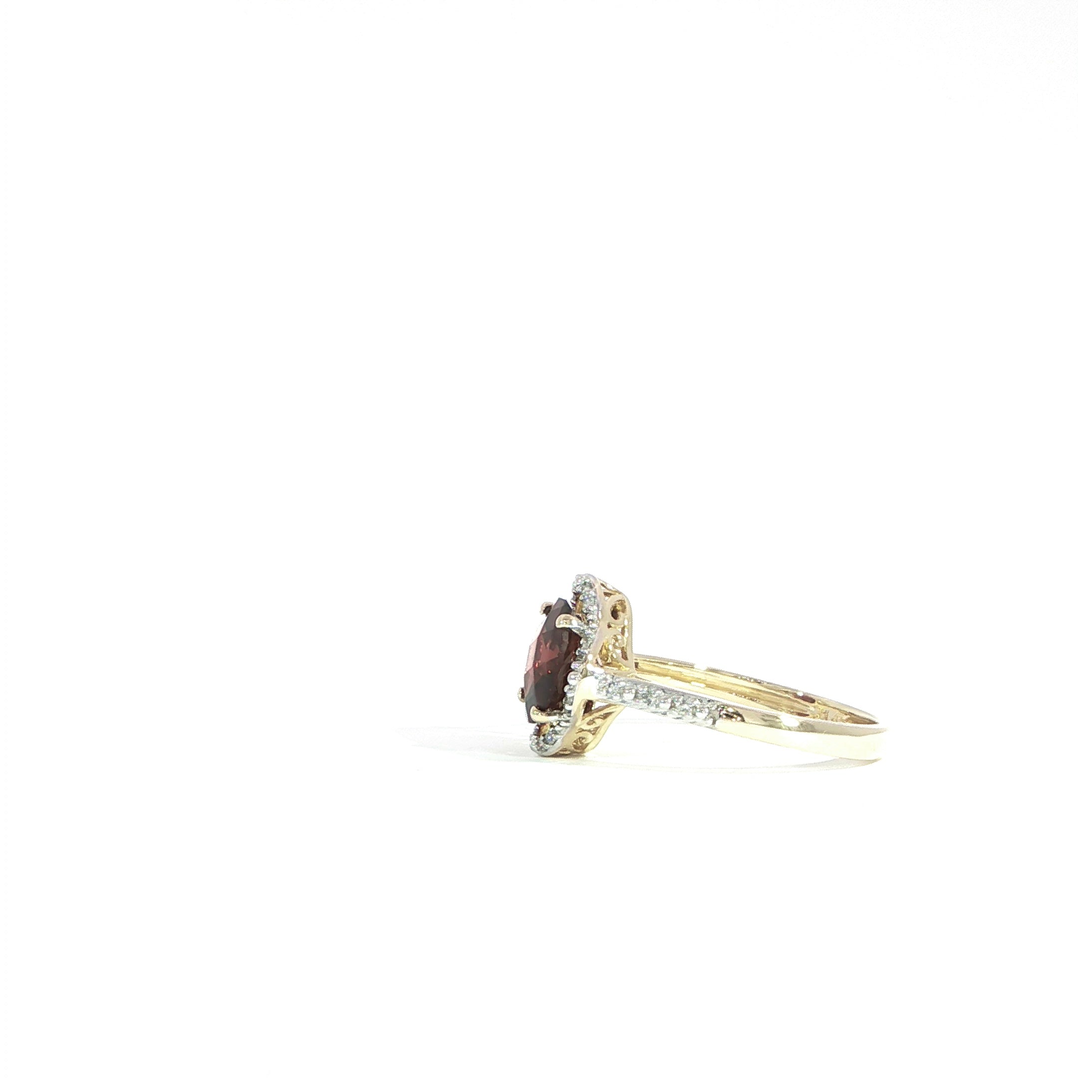 Side profile garnet ring with diamond halo