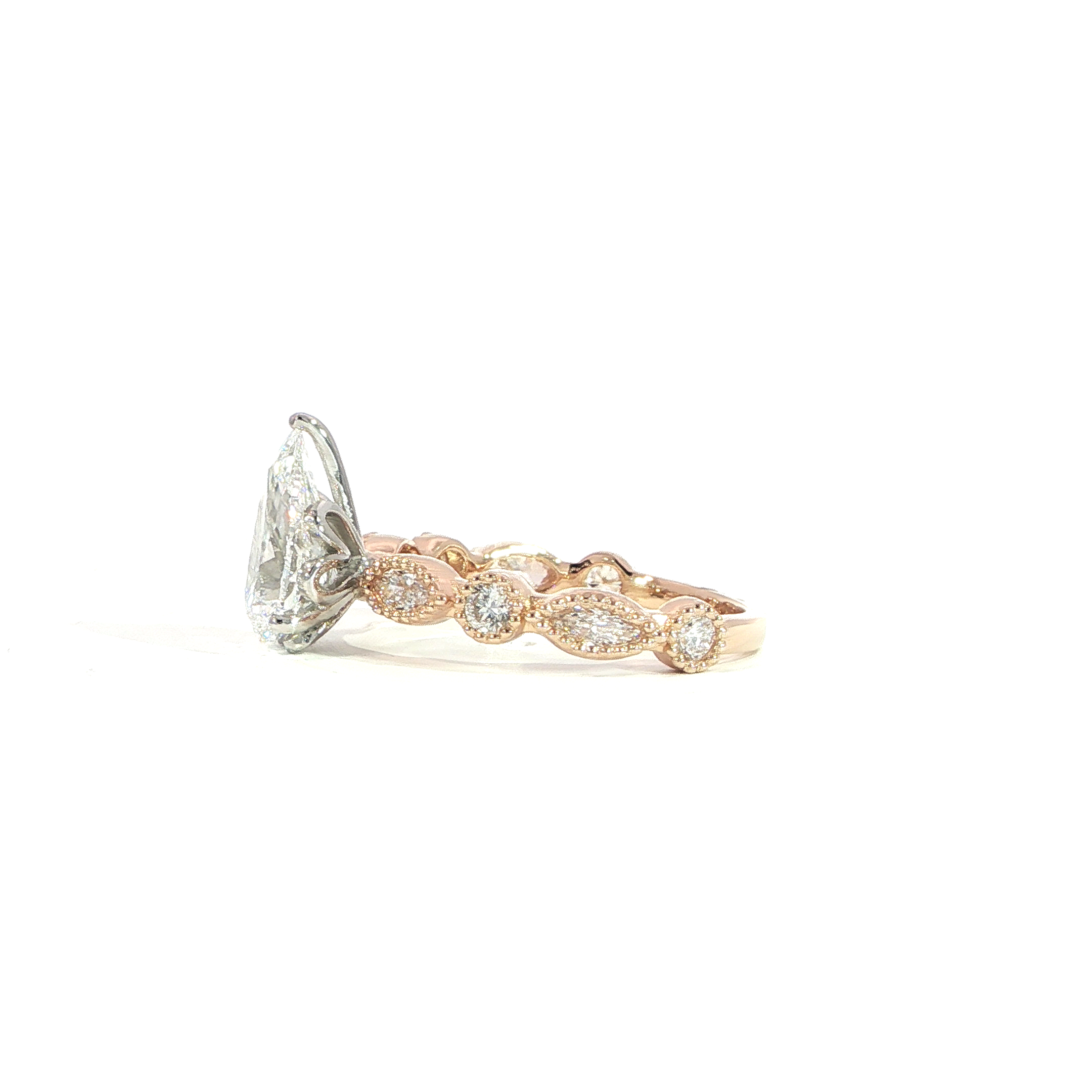 Side of 2 carat pear diamond ring with detailed band