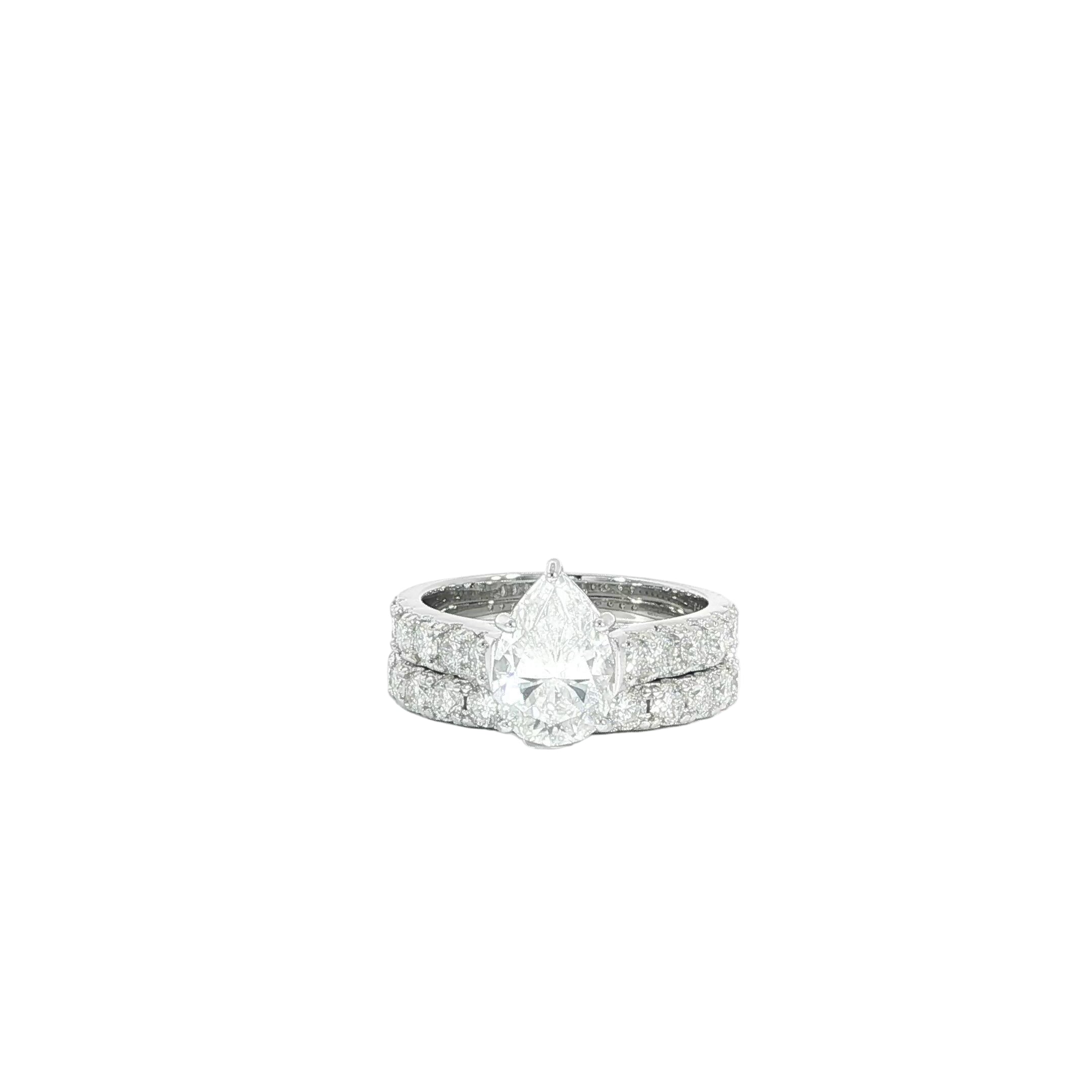 Sterling silver pear moissanite engagement ring set close up
