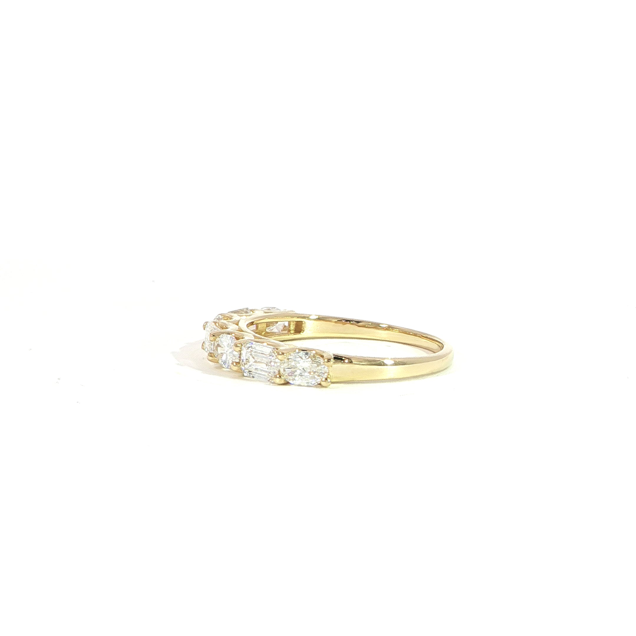 Side view of 14K gold mixed shape diamond band