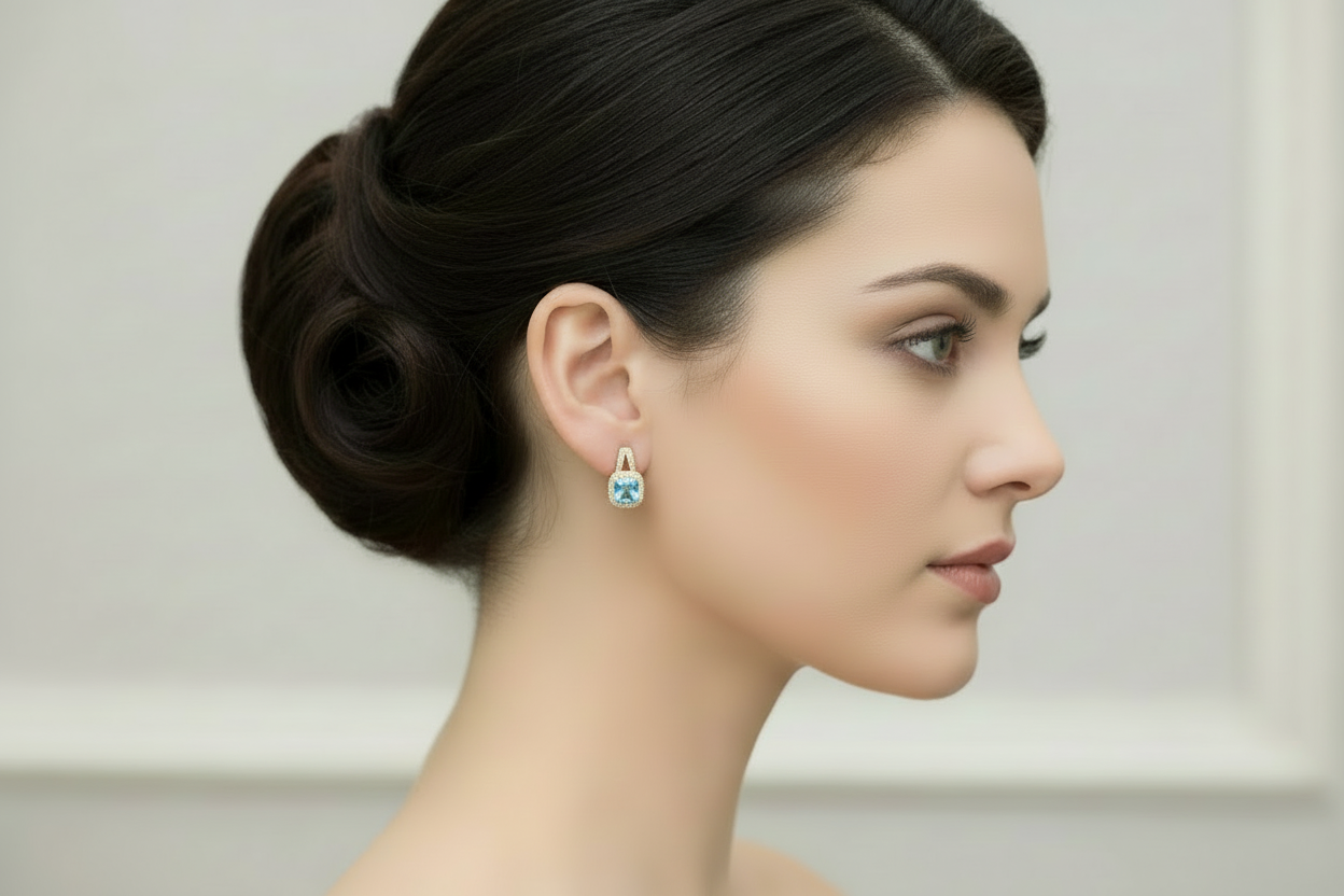 Elegant blue topaz and diamond drop earrings in 14K yellow gold