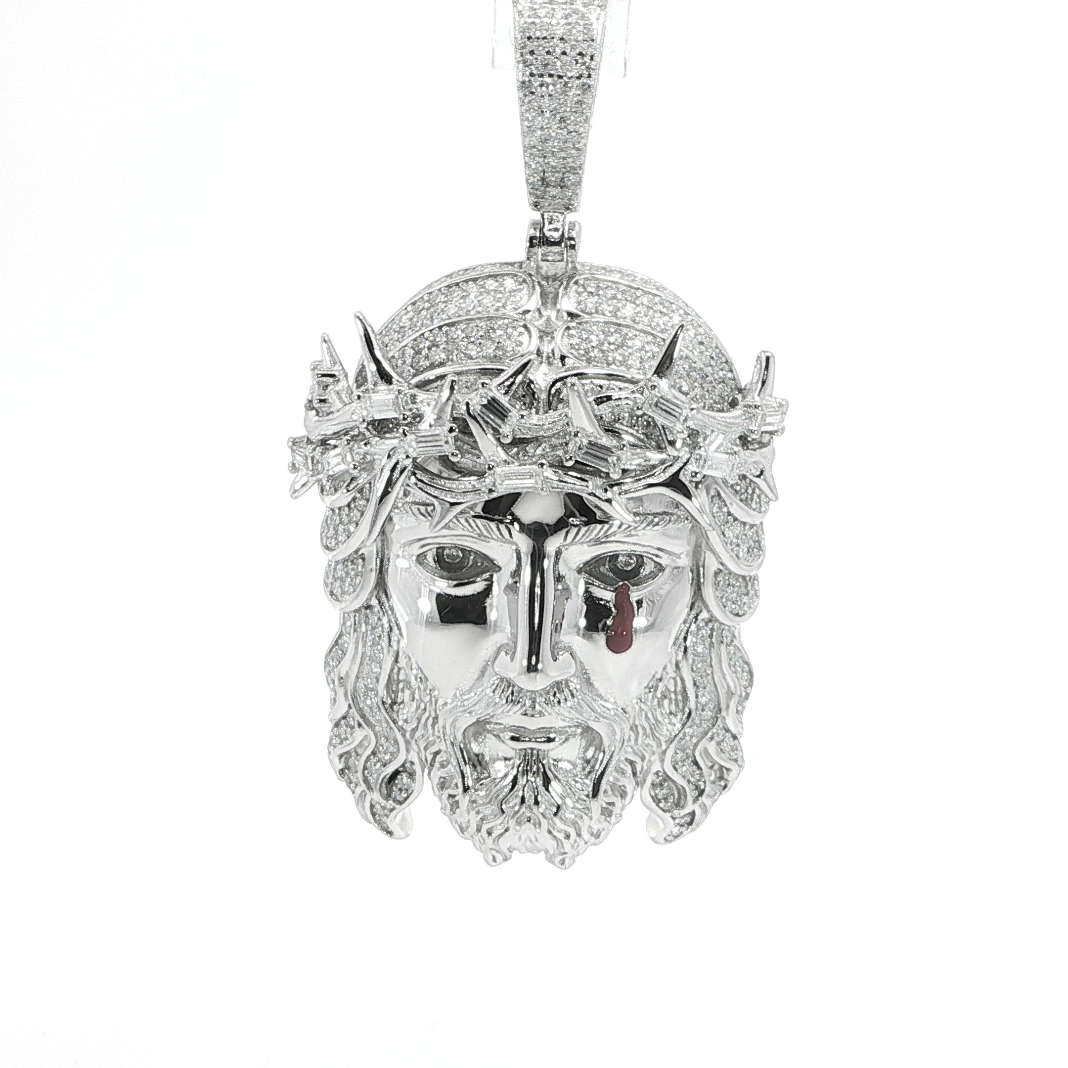 Detailed facial features on Christ pendant with moissanite stones