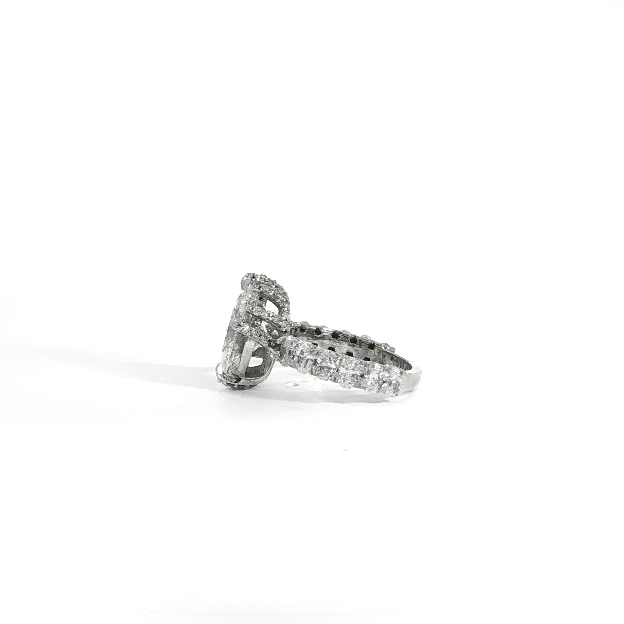 Custom oval diamond engagement ring featuring nature-inspired branch prongs