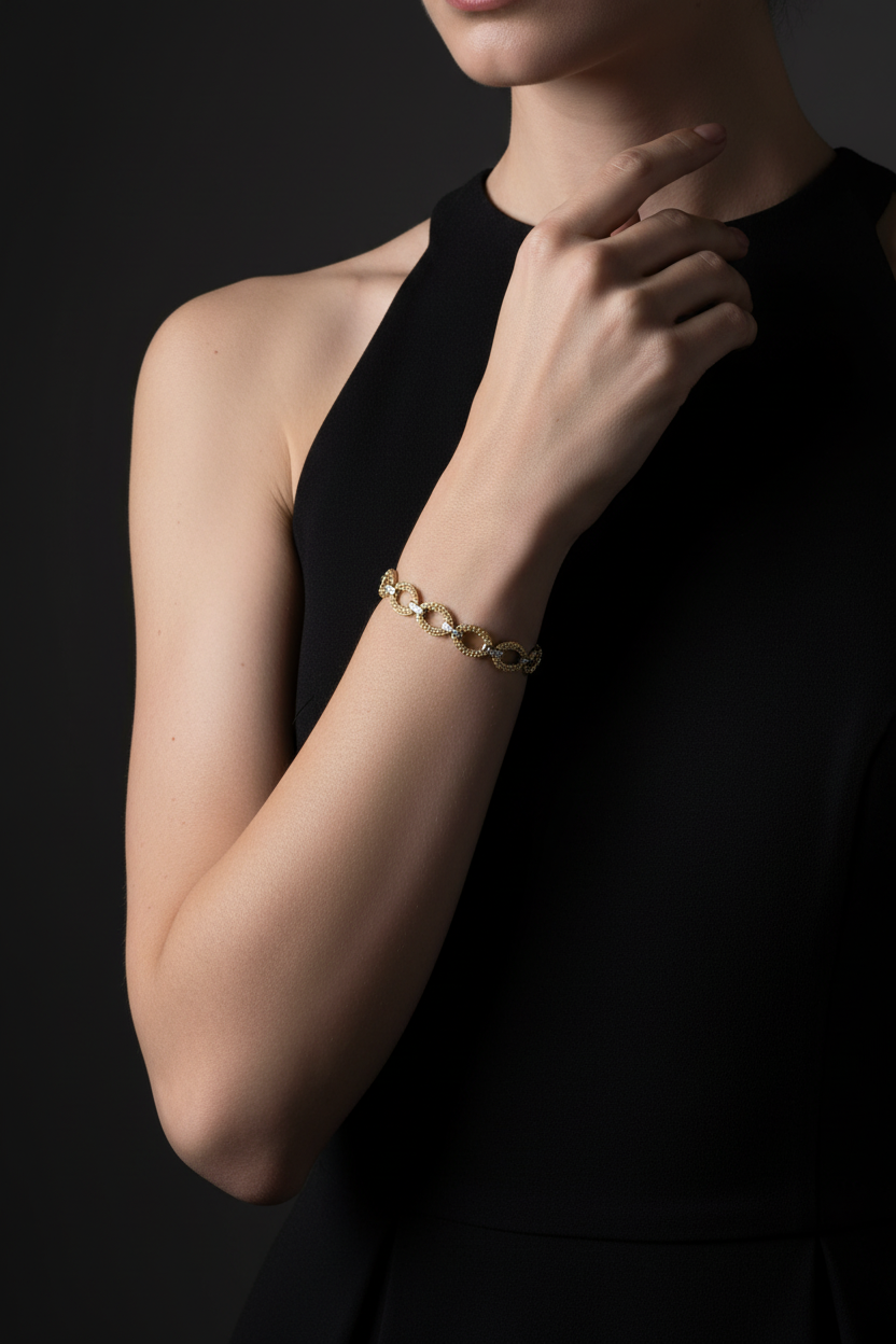 Women's 14K gold filigree oval bracelet featuring diamond-cut accent bars