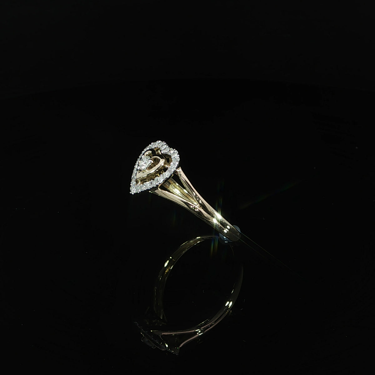 10K yellow gold 0.19 CTW promise ring featuring a diamond heart outline around an open gold heart.