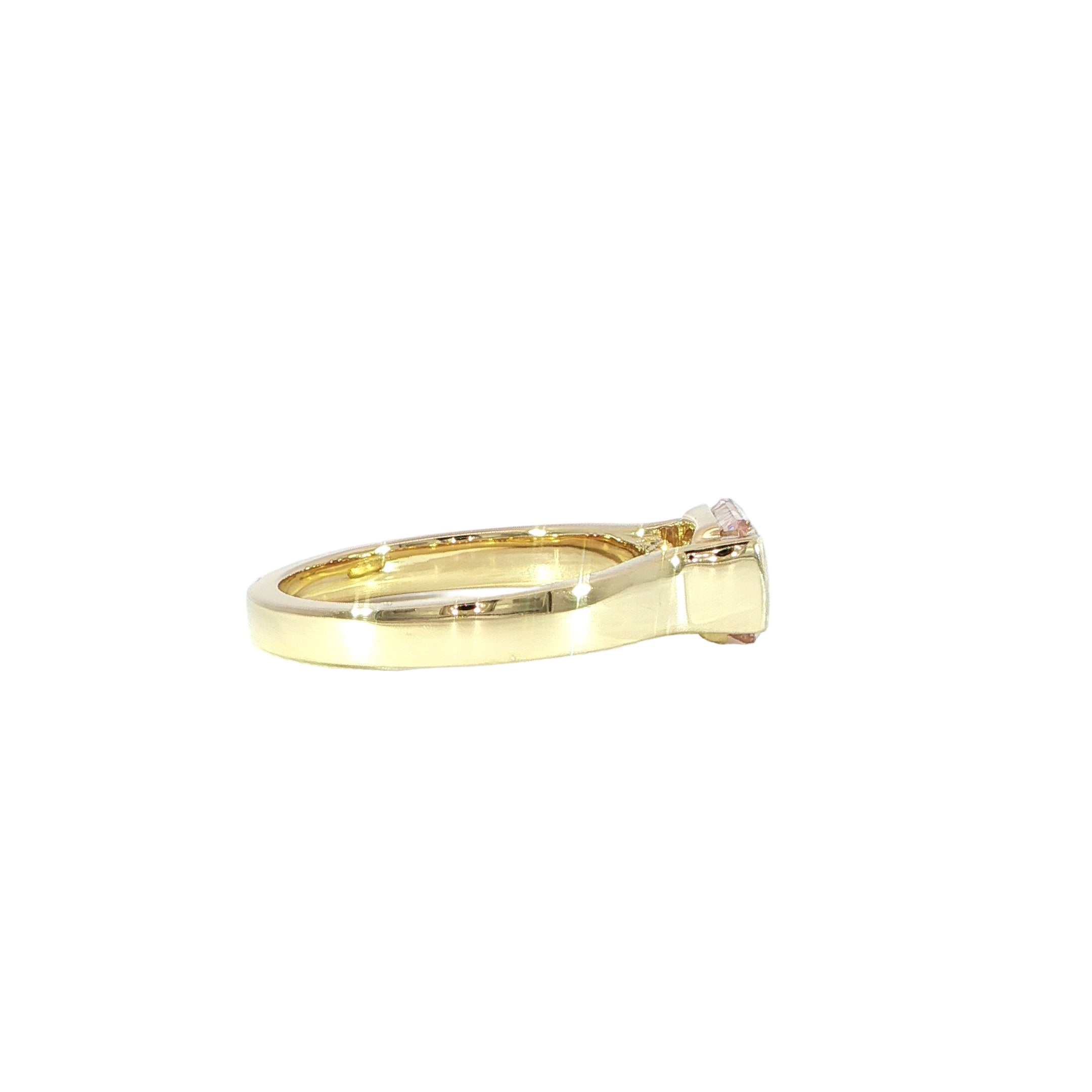 Bezel set pink radiant diamond ring with yellow gold band
