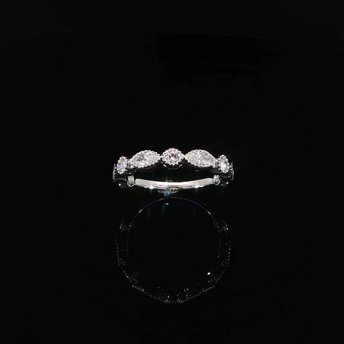 lab-grown diamond band highlighting its alternating stone shapes and beaded white gold borders.