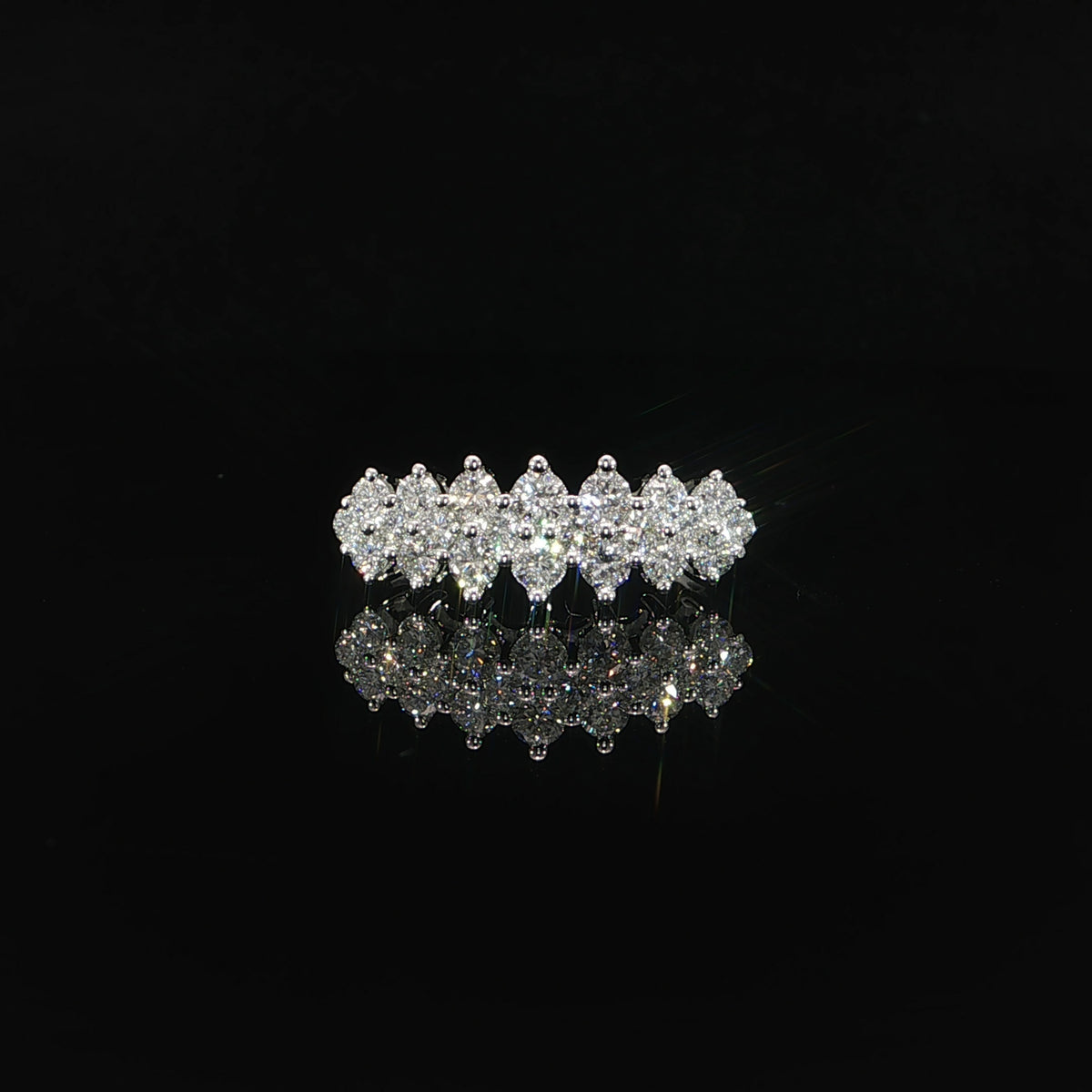 Front view of an anniversary band with staggered rows of lab-grown diamonds.