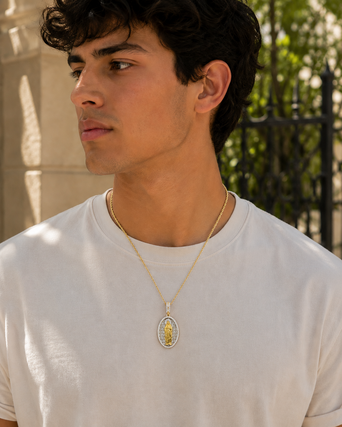 Oval religious pendant with detailed Virgin Mary design and iced halo