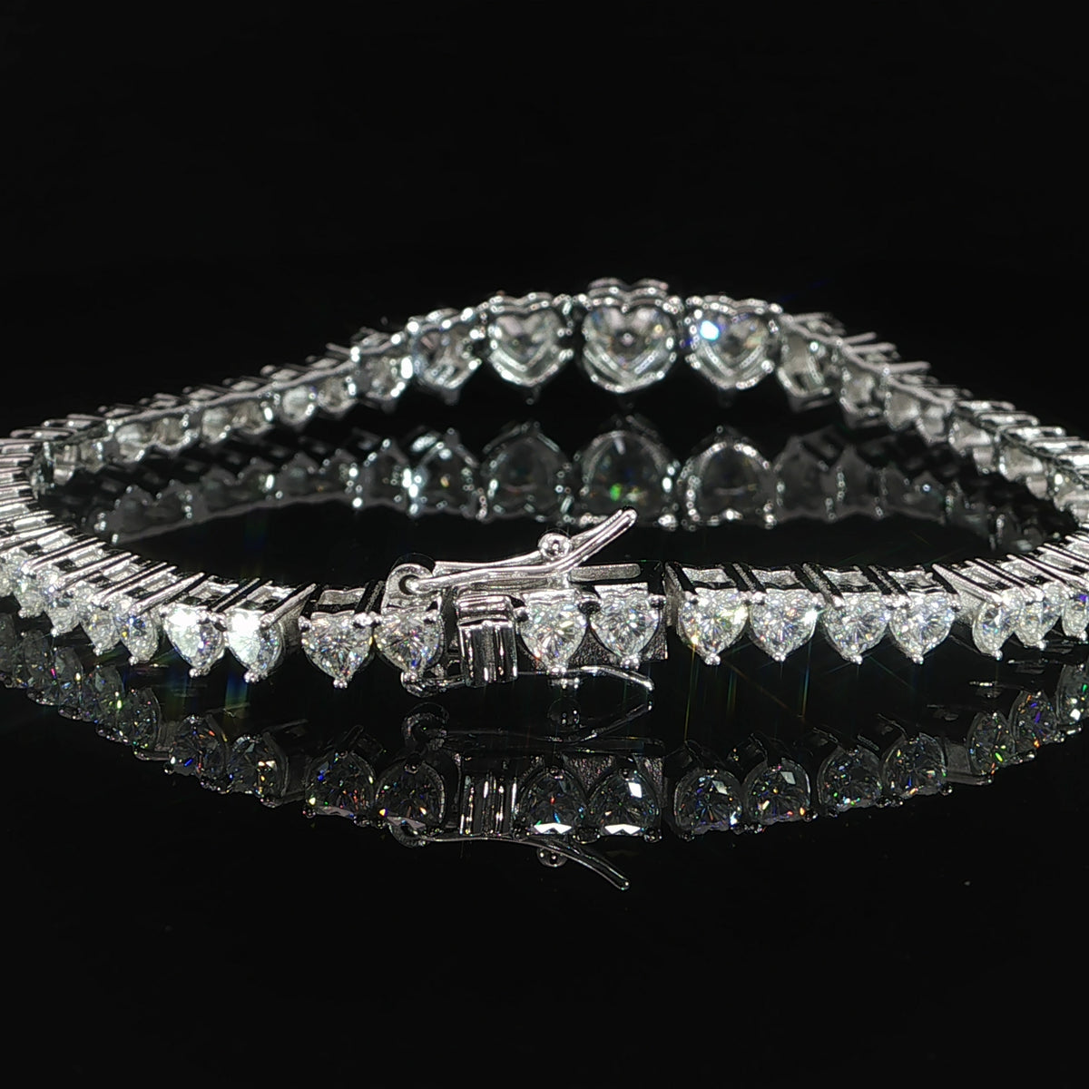 Clasp view of a sterling silver graduated heart moissanite bracelet