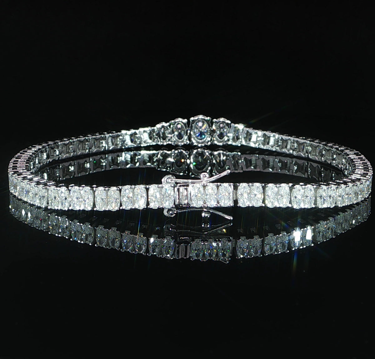 Clasp view of a sterling silver graduated oval moissanite bracelet