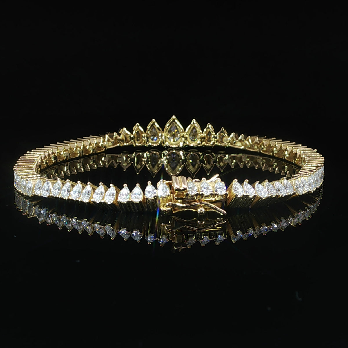 Clasp view of a sterling silver graduated pear moissanite bracelet