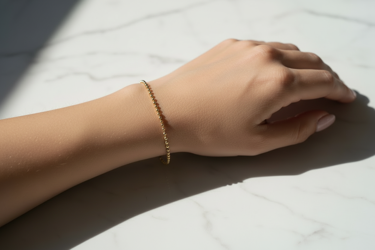 14K yellow gold bracelet featuring diamond cut beads
