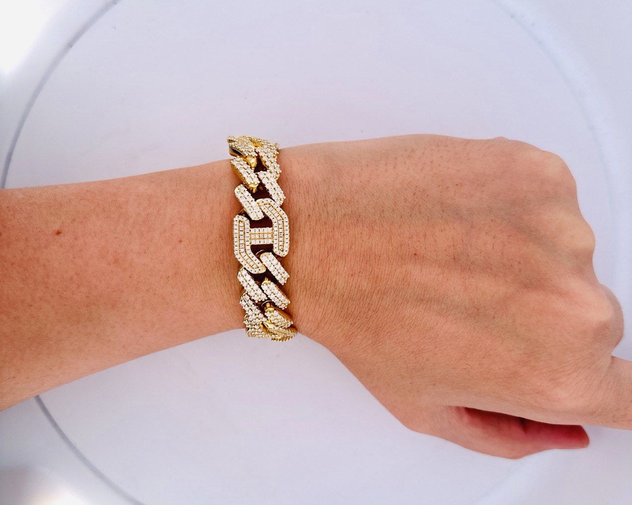 Designer style Cuban bracelet with pavé set VVS moissanite and bold masculine appeal