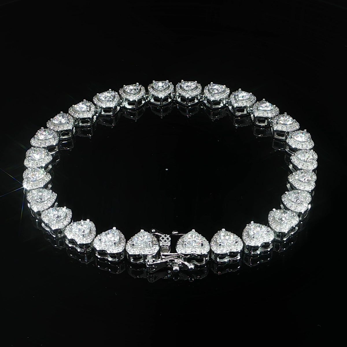 Clasp view of a sterling silver heart halo tennis bracelet