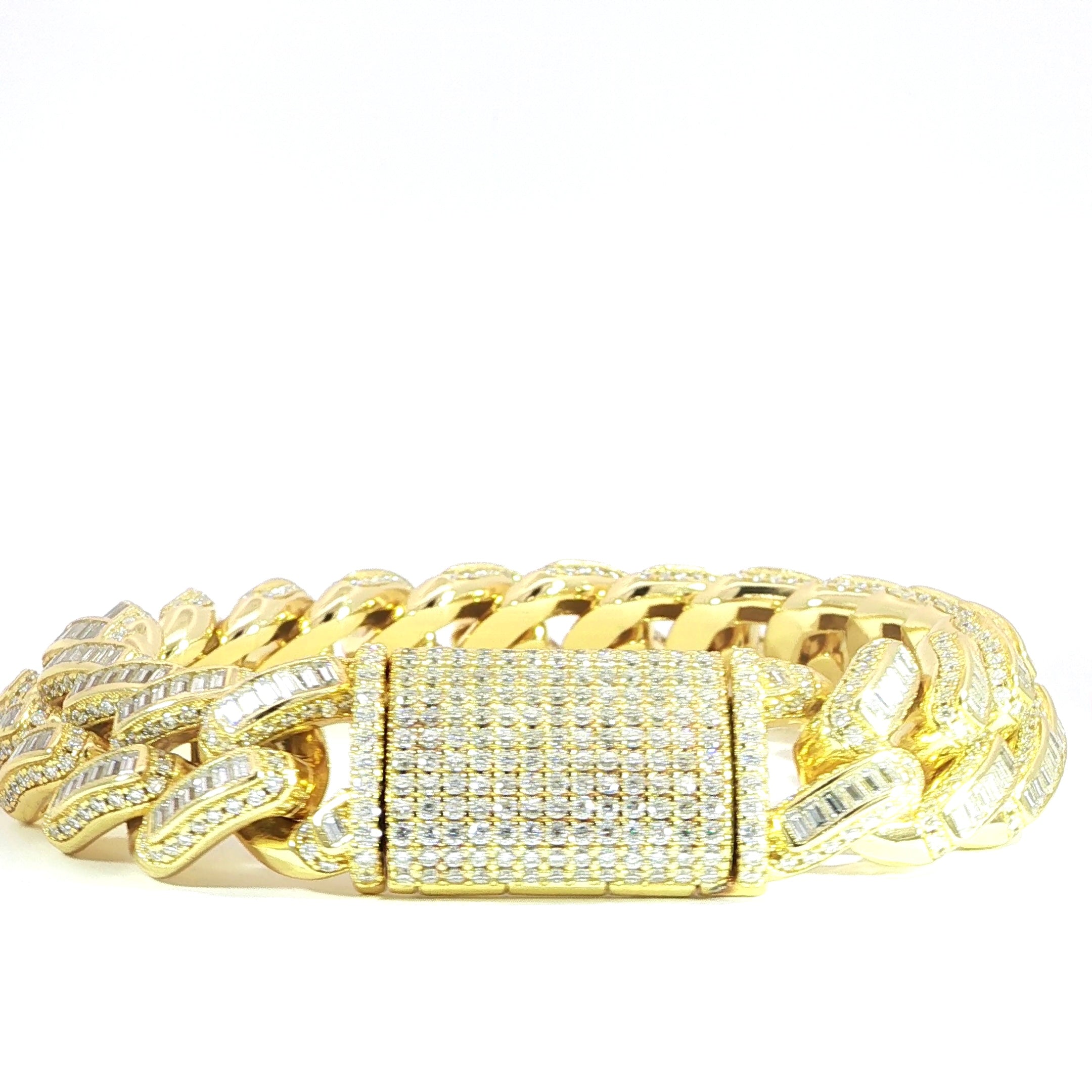 16MM iced out Miami Cuban bracelet with baguette center links in sterling silver.