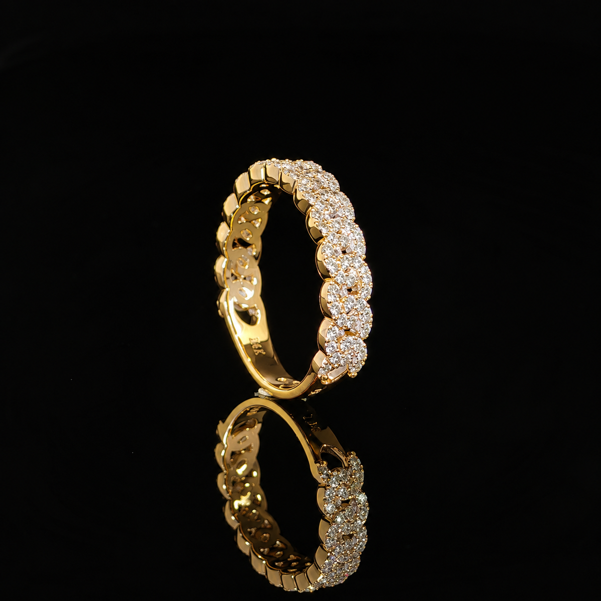 Side profile of a lab-grown diamond chain-link ring showing polished setting walls and openings inside the band.