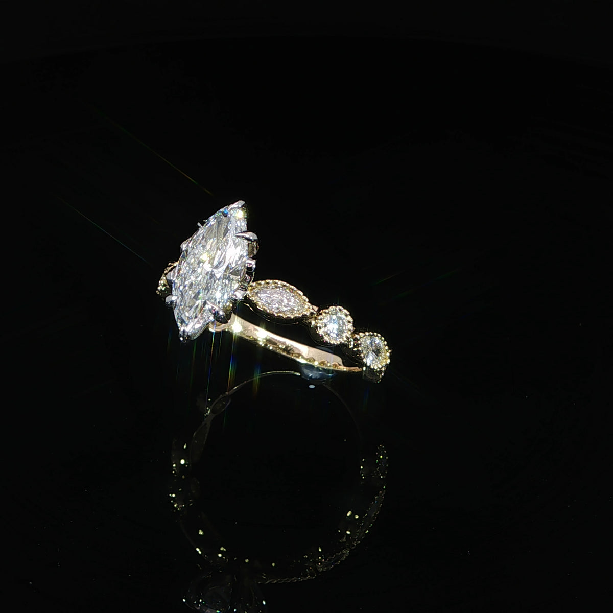 14K yellow gold marquise engagement ring with 1.53 CT lab diamond and bezel set accent diamonds