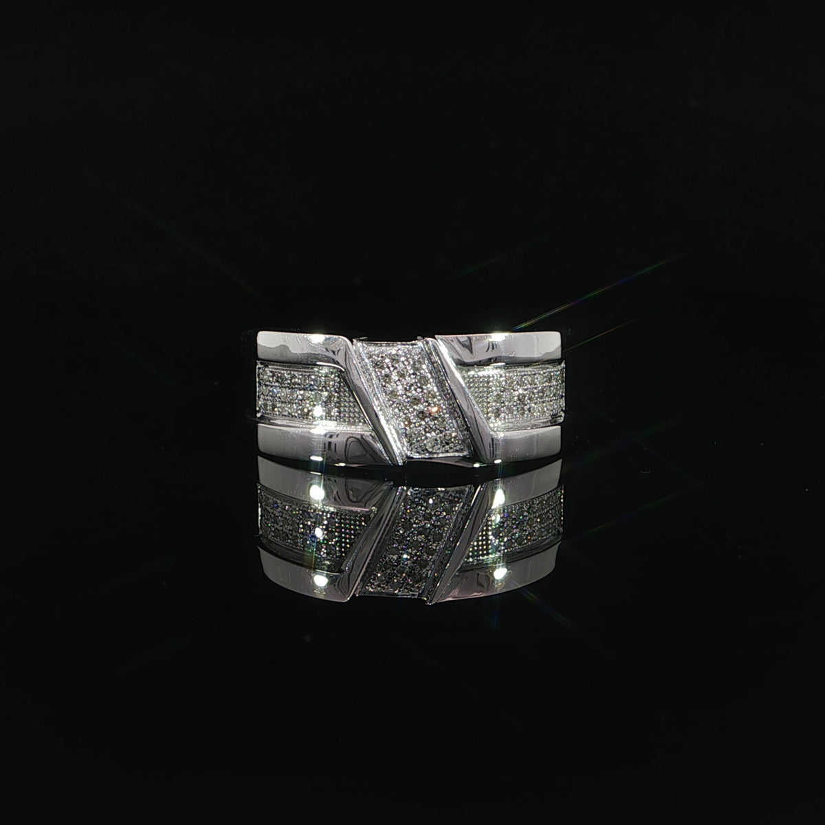 Elevated front view of a men’s white gold diamond band with a diagonal center panel and polished borders.