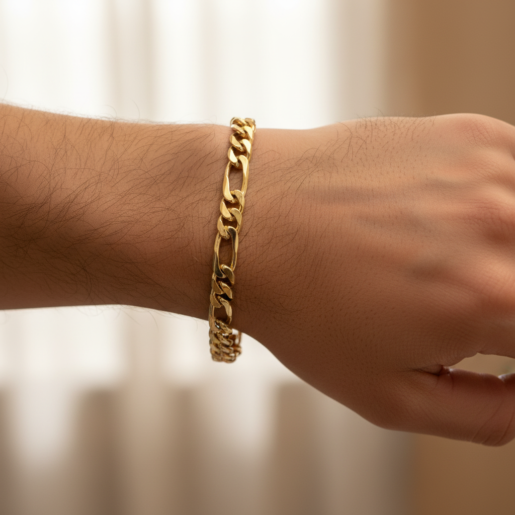 10K gold Figaro bracelet with polished finish hand model
