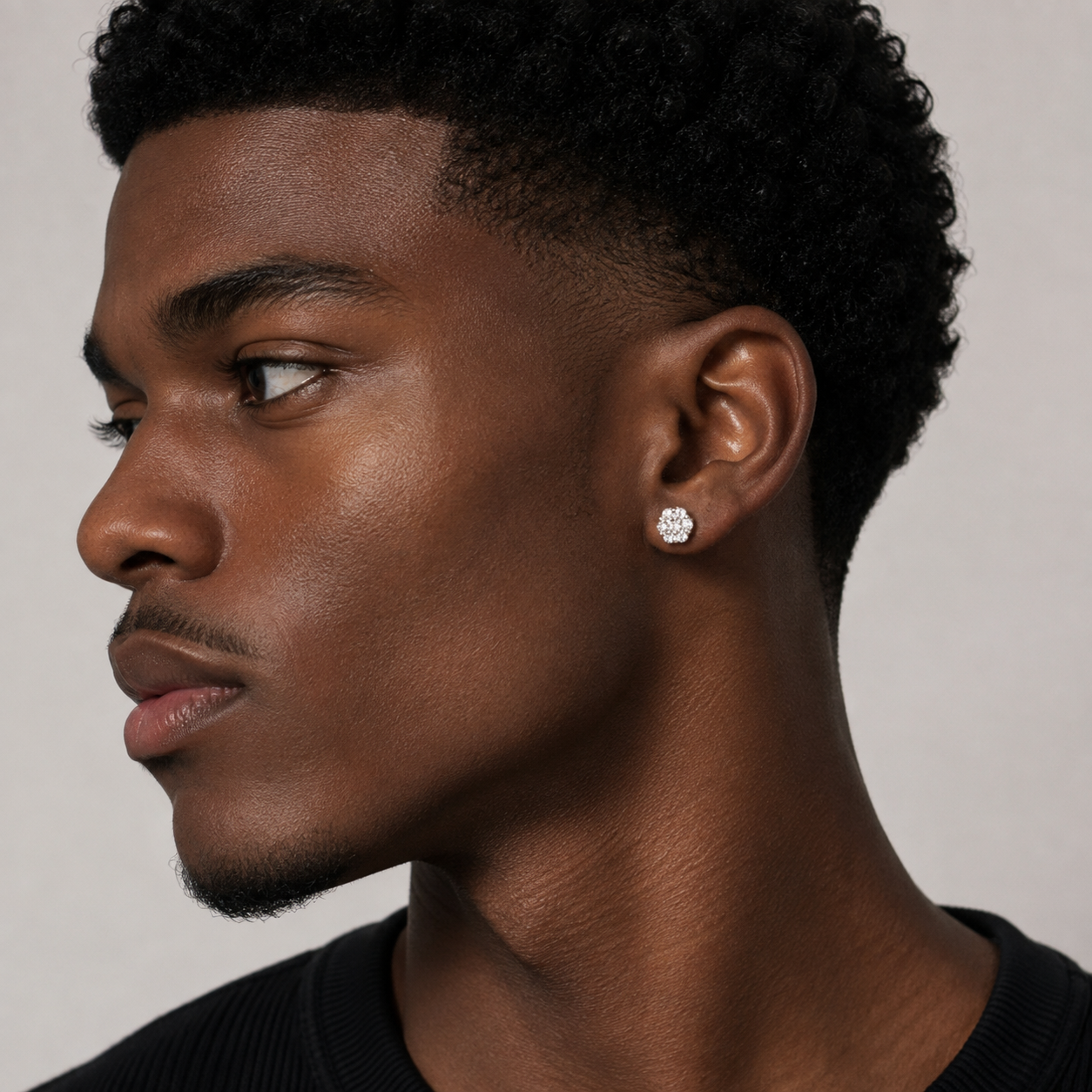 Model wearing 0.72 CTW lab-grown diamond stud earrings crafted in yellow gold