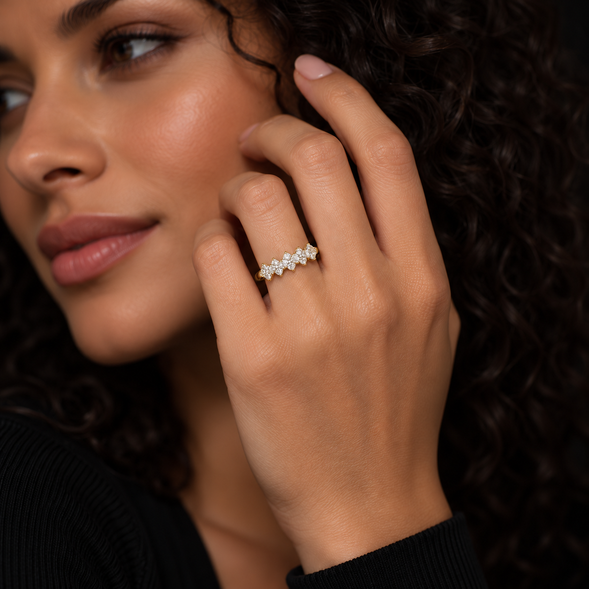 Yellow gold diamond cluster ring with an open gallery and smooth polished band.